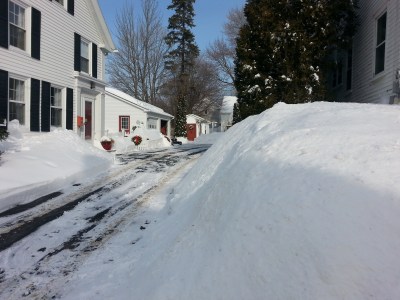 Snow buries signs and homes